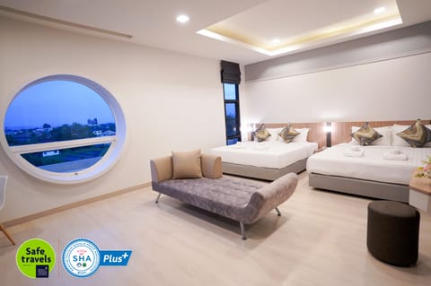 Premier Quadruple Room | Free minibar items, in-room safe, individually decorated, desk
