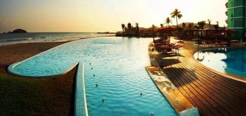 Outdoor pool, open 9 AM to 9 PM, pool umbrellas, sun loungers