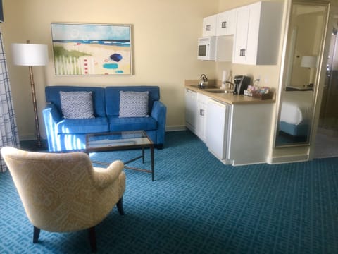 Suite, 1 King Bed with Sofa bed, Garden View | Living area | 49-inch flat-screen TV with cable channels, TV, iPod dock