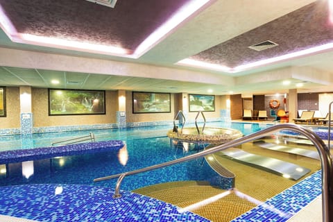 2 indoor pools, outdoor pool, open 9:00 AM to 8:00 PM, pool umbrellas