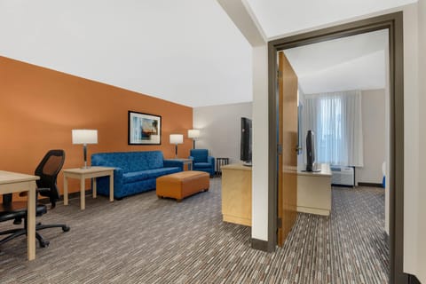 Desk, laptop workspace, blackout drapes, free cribs/infant beds