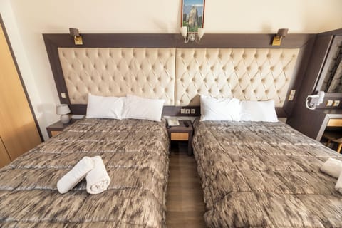 Quadruple Room | Premium bedding, pillowtop beds, desk, blackout drapes