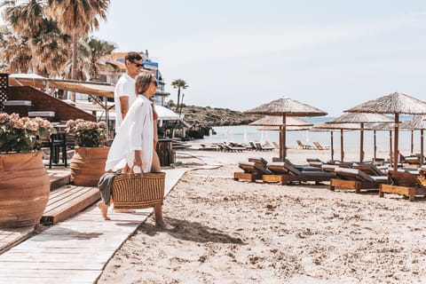 On the beach, sun loungers, beach umbrellas, beach towels