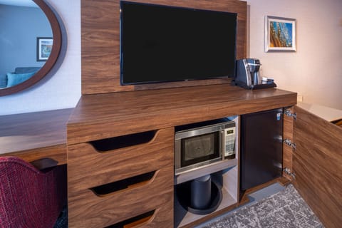 Hypo-allergenic bedding, desk, laptop workspace, blackout drapes