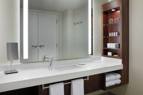 Eco-friendly toiletries, hair dryer, slippers, towels