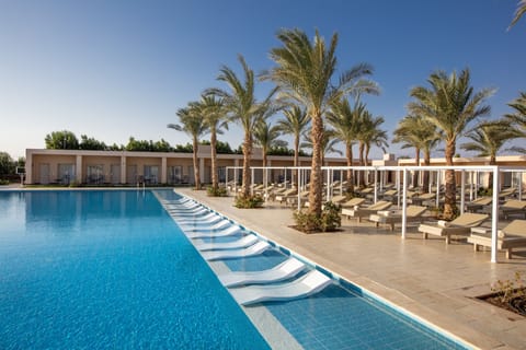 Outdoor pool, open 7 AM to 6:00 PM, pool umbrellas, sun loungers