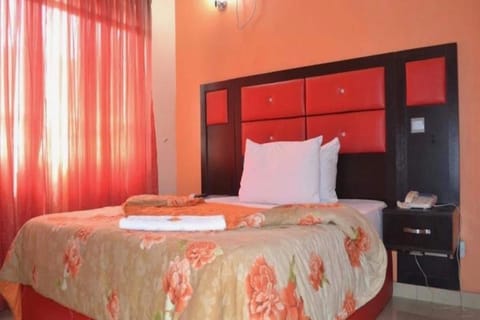 Desk, laptop workspace, bed sheets