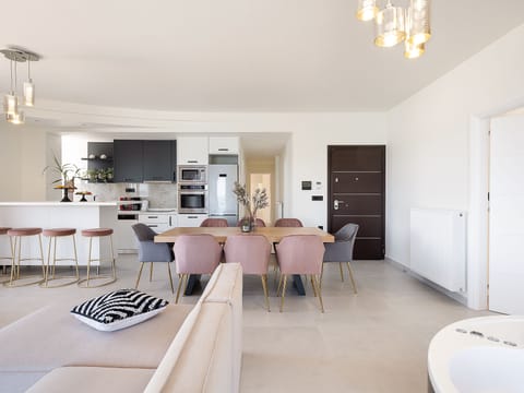 Apartment, Sea View, Beachfront | Living area | Flat-screen TV, fireplace