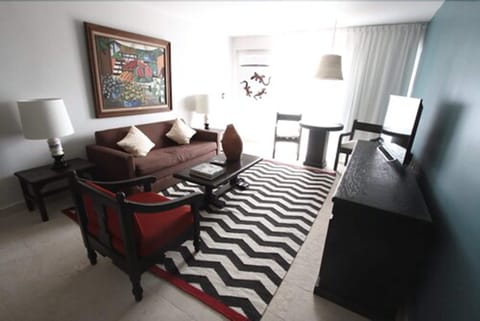 Luxury Suite, Hot Tub, Garden View | Living area | 32-inch LCD TV with cable channels, TV