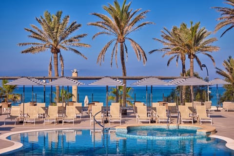 Indoor pool, seasonal outdoor pool, pool umbrellas, sun loungers