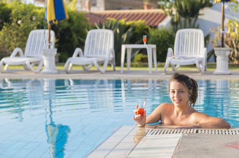 Indoor pool, seasonal outdoor pool, open 9 AM to 7 PM, pool umbrellas