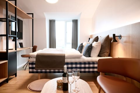 Premium bedding, desk, laptop workspace, free WiFi