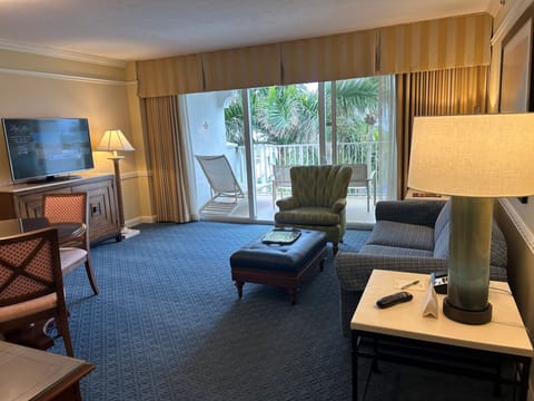 Executive Suite, 1 Bedroom, 2 Double Beds | Living area | 49-inch flat-screen TV with satellite channels, TV, foosball