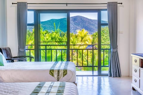 Deluxe Room with Mountain View | In-room safe, individually furnished, desk, blackout drapes
