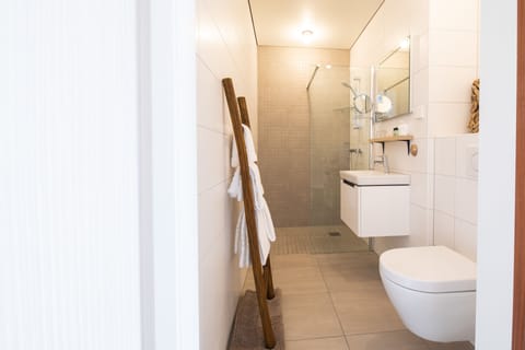 Designer toiletries, hair dryer, bathrobes, towels