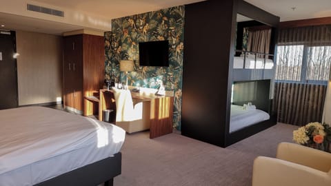 Executive Quadruple Room | In-room safe, desk, laptop workspace, blackout drapes