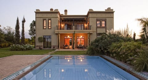 Outdoor pool, a heated pool, pool umbrellas, sun loungers