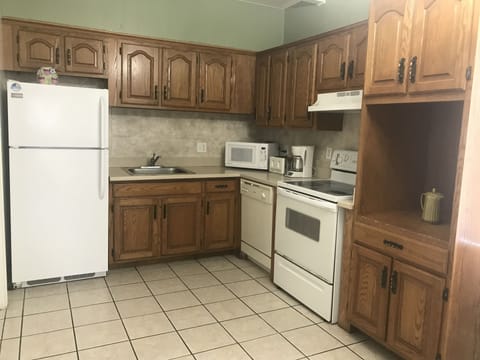 Deluxe Apartment, 2 Bedrooms, Kitchen, City View (Shared Balcony, A02) | Private kitchen | Full-size fridge, microwave, oven, stovetop
