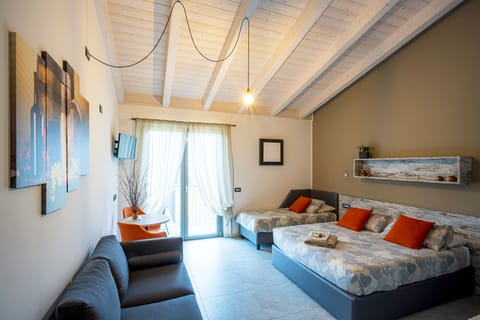 Triple Room, Terrace | Down comforters, memory foam beds, in-room safe, individually furnished