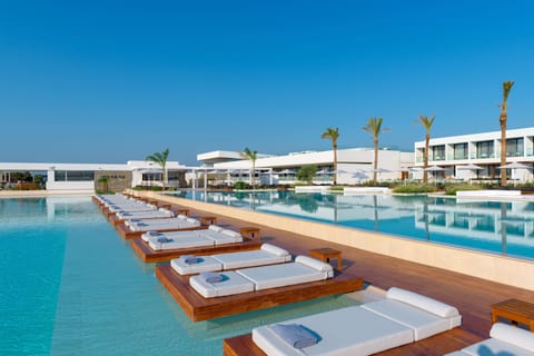 Indoor pool, 4 outdoor pools, open 10 AM to 6 PM, pool umbrellas