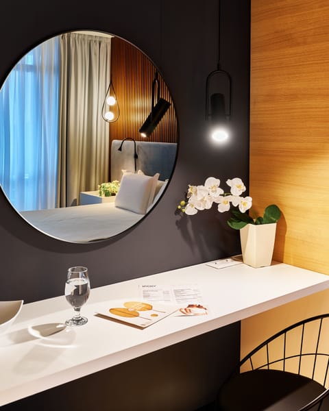 Hypo-allergenic bedding, down comforters, minibar, in-room safe