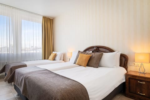 Standard Triple Room (with Free Parking) | 1 bedroom, desk, laptop workspace, blackout drapes