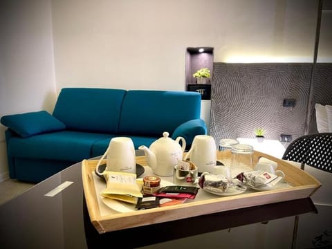 Junior Suite, Balcony, Sea View | Minibar, in-room safe, desk, iron/ironing board