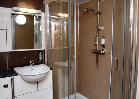 Designer toiletries, hair dryer, towels