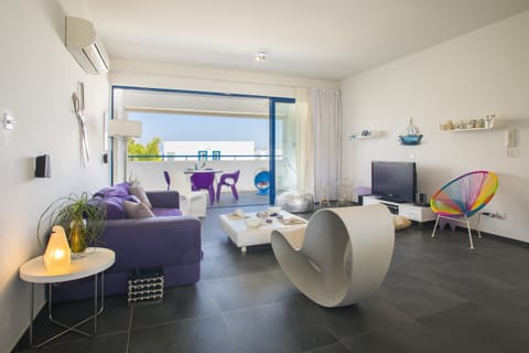 Apartment, 2 Bedrooms, Pool Access, Pool View | Living area | Flat-screen TV