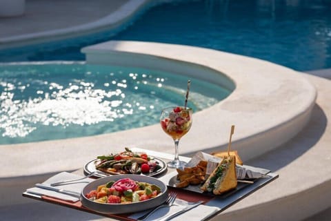 Outdoor pool, pool umbrellas, sun loungers