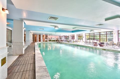 Indoor pool, outdoor pool, pool umbrellas, sun loungers
