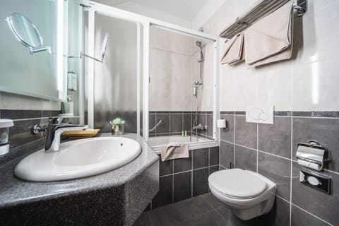 Designer toiletries, hair dryer, bathrobes, slippers