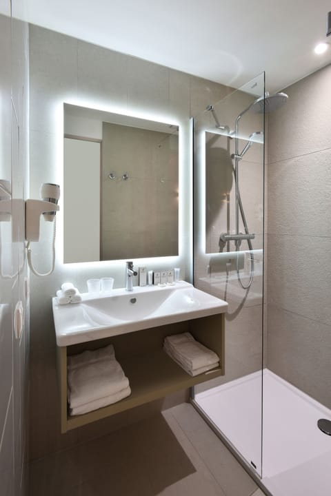 Shower, rainfall showerhead, hair dryer, towels