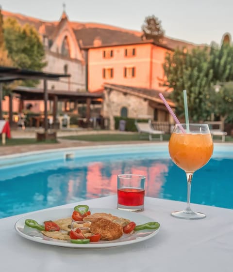 Outdoor pool, pool umbrellas, sun loungers