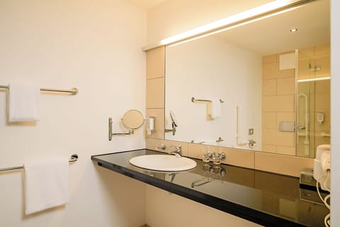 Shower, hair dryer, heated floors, towels