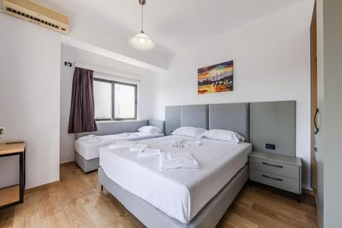 Triple Room, Sea View | Minibar, in-room safe, iron/ironing board, free WiFi