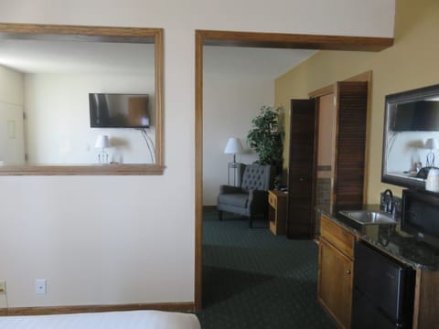 Suite, 1 King Bed, Non Smoking, Hot Tub | Desk, laptop workspace, blackout drapes, iron/ironing board