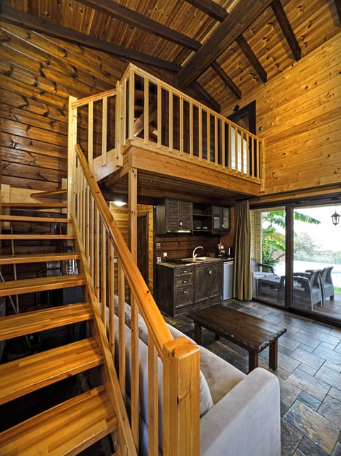 The Woodland Cottage - 2 Bedroom Villa with Sea View, Sauna & Shared Pool | Living area | Flat-screen TV