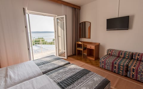 Family Quadruple Room, Balcony, Sea View | In-room safe, desk, rollaway beds, free WiFi