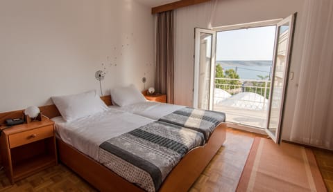 Family Quadruple Room, Balcony, Sea View | In-room safe, desk, rollaway beds, free WiFi