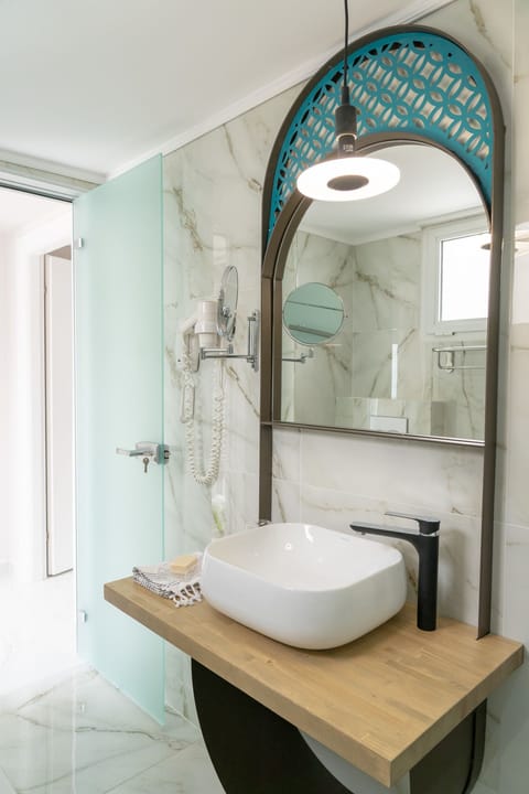 Designer toiletries, hair dryer, bathrobes, slippers