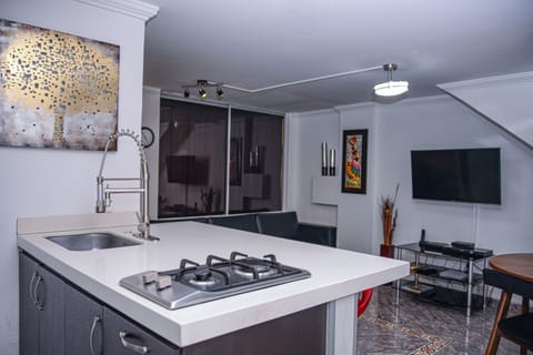 Apartment, 2 Bedrooms | Private kitchen | Full-size fridge, microwave, stovetop, coffee/tea maker