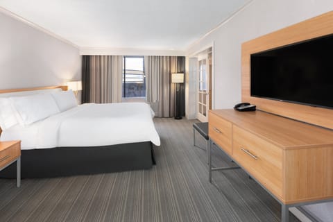 Premium bedding, desk, laptop workspace, iron/ironing board