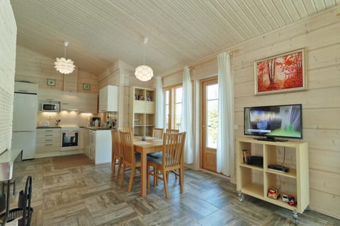Family Villa, 2 Bedrooms, Sauna, Lakeside | Living area | 32-inch LED TV with digital channels, Smart TV, fireplace