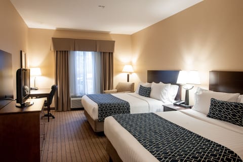 Pillowtop beds, desk, blackout drapes, iron/ironing board