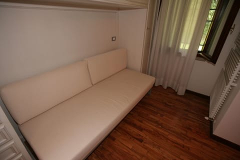 Quadruple Room | Living area | Flat-screen TV