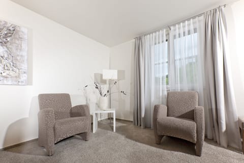 Junior Suite | Living area | Flat-screen TV