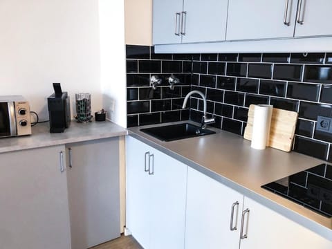 Fridge, stovetop, espresso maker, coffee/tea maker