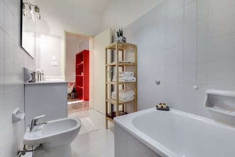 Apartment, 1 Bedroom | Bathroom | Combined shower/tub, deep soaking tub, rainfall showerhead, hair dryer