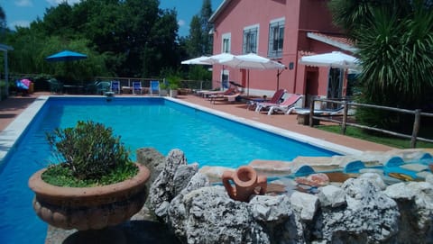 Seasonal outdoor pool, open 9:00 AM to 5:30 PM, pool umbrellas